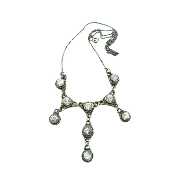A beautiful antique Edwardian necklace made of sterling silver with a fine, delicate chain and rock crystal stones similar in design to a lavaliere necklace with a fringe and three droppers.