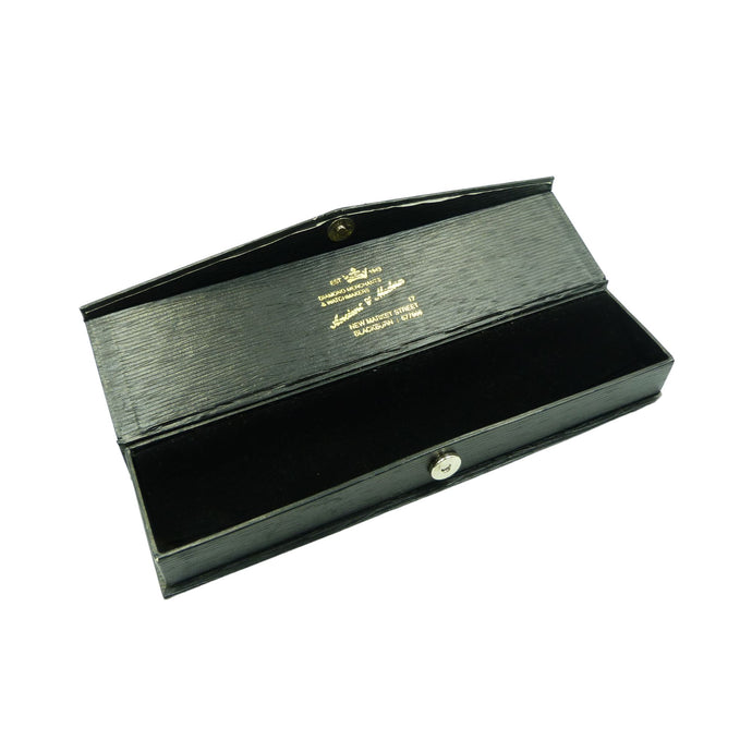 A vintage black jewellery box with a black velvet lining ideal for storing a watch from Ancient and Modern watchmakers of Blackburn.