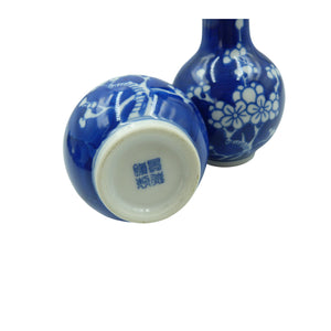 A pair of beautiful Chinese porcelain small bud vases hand painted in a striking cobalt blue colour with a pretty Prunus trees pattern.  Both vases are signed underneath with hand painted blue underglaze Jingdezhen Zhi mark.