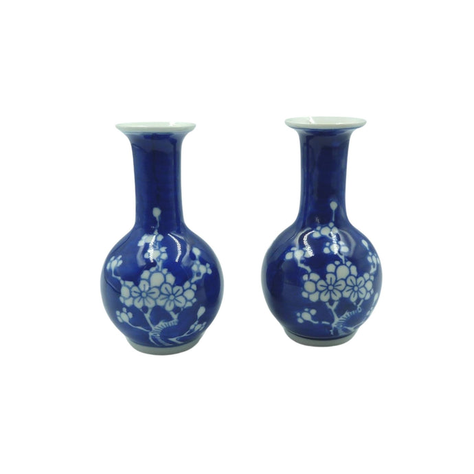 A pair of beautiful Chinese porcelain small bud vases hand painted in a striking cobalt blue colour with a pretty Prunus trees pattern.  Both vases are signed underneath with hand painted blue underglaze Jingdezhen Zhi mark.